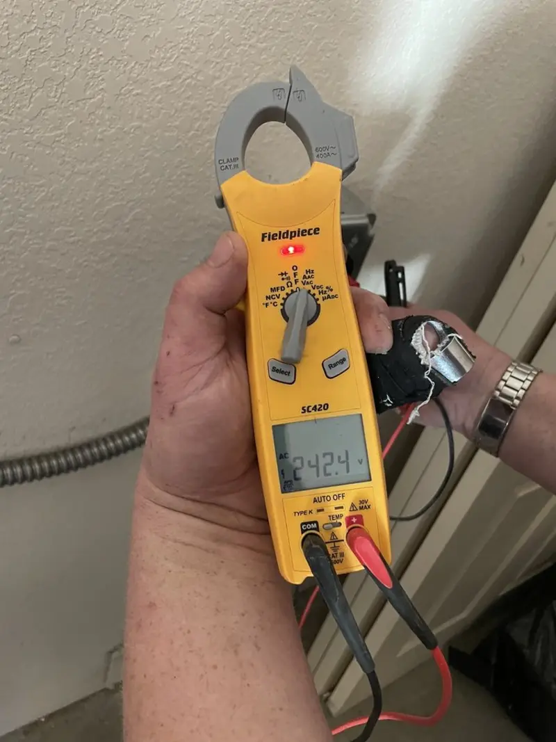 Voltage testing with clamp meter during Ceiling Fan Installation in Lincolnton